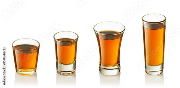 Fototapeta set of shot glasses with tequila or liqueur isolated on white background