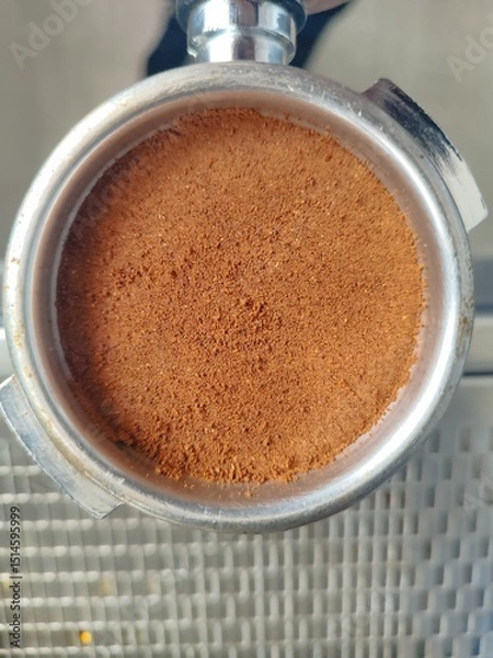 Obraz coffee beans in a holder on a coffee machine background
