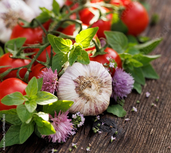 Obraz Fresh vegetables and aromatic herbs on wooden table, close up view