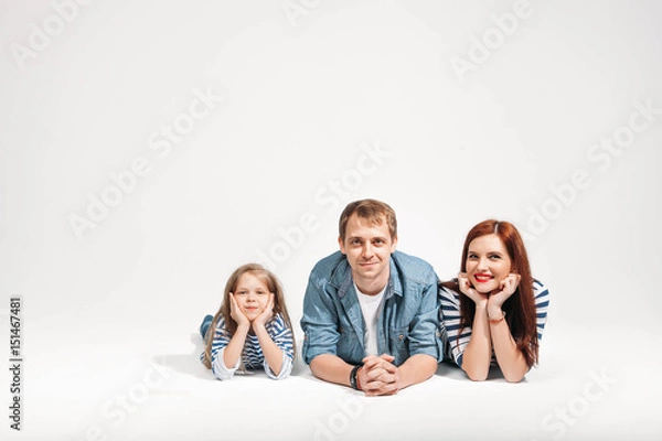 Fototapeta Happy funny family portrait lying on white background isolated