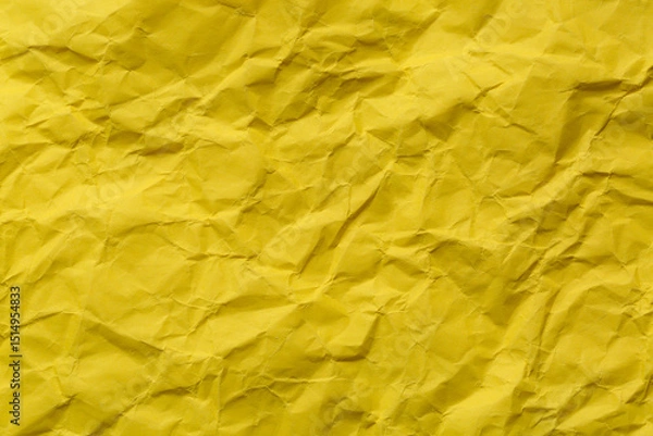 Fototapeta Close-up of yellow crumpled paper background,Macro yellow crumpled paper texture,Macro close up of yellow crumpled paper texture, Crumpled sheet of yellow paper close up. 