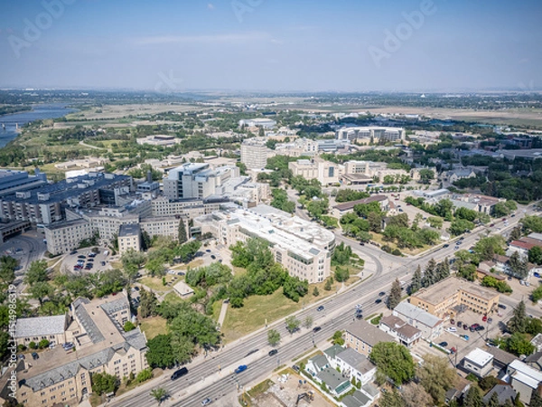 Fototapeta City view from above with a lot of buildings and a river