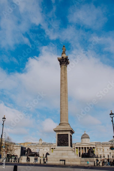 Fototapeta London's iconic Trafalgar Square is captured with its towering Nelson's Column monument, a central landmark surrounded by grand architecture and the vibrant energy of the city.