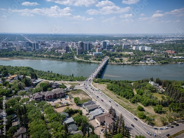 Fototapeta City view with a bridge over a river