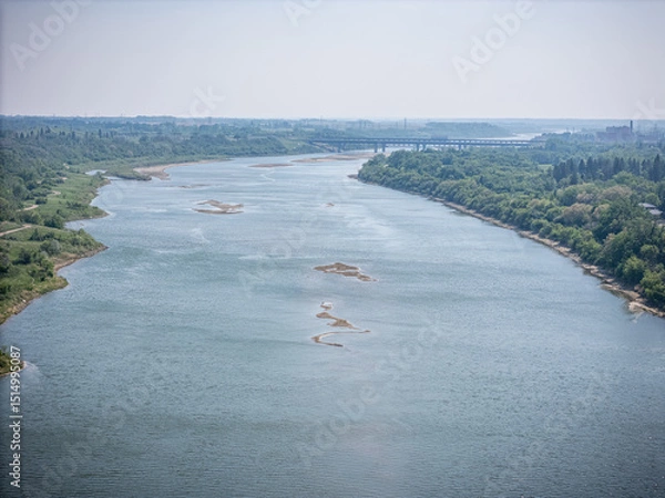 Fototapeta River with a bridge in the background