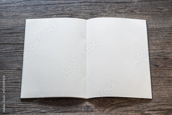 Fototapeta Book mockup with blank opening page a4 paperback mock up for catalog, magazine, menu, booklet, notebook, portfolio design template on wood table background