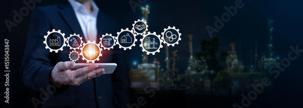 Fototapeta Smart industrial future with technology and innovation. Using smartphone and digital gears to optimize energy, oil, refinery and industrial services for global business.