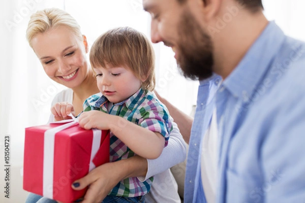 Obraz happy family with birthday gift at home