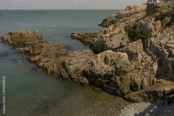 Fototapeta Rocky coastline landscape, natural daylight, peaceful sea view at Busan, South Korea, Haedong Yonggungsa Temple