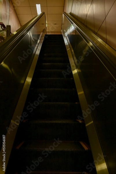 Fototapeta Close-up of the escalator. escalator convergence line. Indoor view.