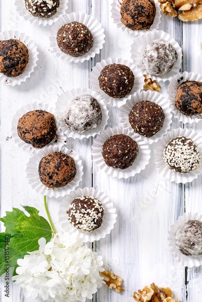 Fototapeta Homemade raw vegan Energy Balls With Different Toppings