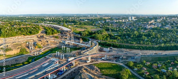 Fototapeta Krakow, Poland. Mistrzejowice highway interchange under construction. Temporary ramp joining S52 and S7 express road from Warszawa. Eastern part of beltway around Cracow just being build. May 25, 2025