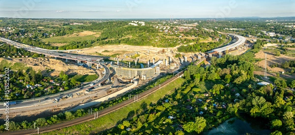 Fototapeta Krakow, Poland. Mistrzejowice highway interchange under construction. Temporary ramp joining S52 and S7 express road from Warszawa. Eastern part of beltway around Cracow just being build. May 25, 2025