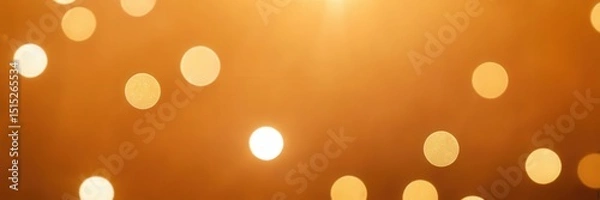 Fototapeta Dreamy scene with soft golden bokeh lights floating on a gentle gradient, creating a warm and magical atmosphere filled with glowing orbs.

