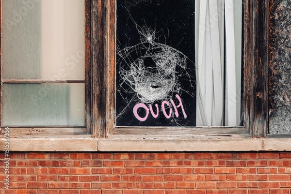 Fototapeta broken window with graffiti 