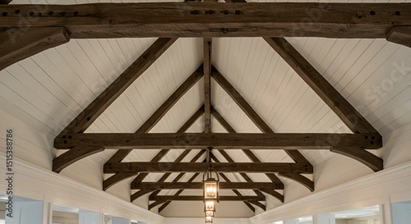 Fototapeta 
 A vaulted ceiling with exposed, weathered wooden beams, white shiplap in between, and hanging lantern-style pendant lights.