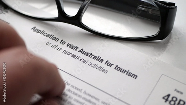 Obraz Finger tapping on application to visit australia