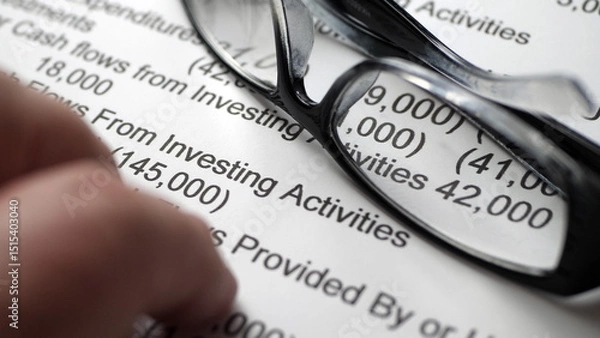 Obraz Finger tapping on financial report