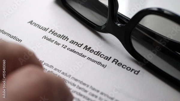 Obraz Finger tapping on health and medical record