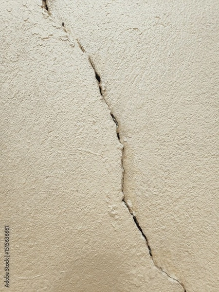 Obraz old wall background, The cement wall painted in cream color has cracks.