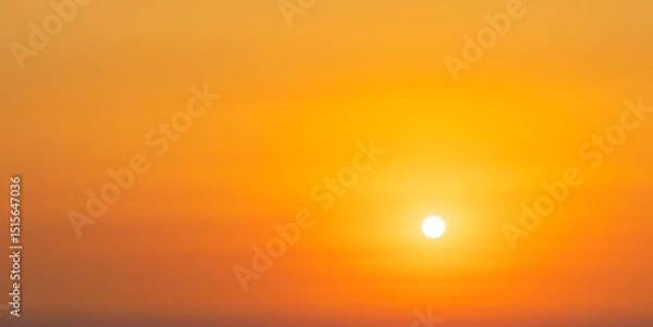 Obraz Spectacular sunrise on the horizon with the sea at your feet. Romantic sunrise. Beach sunrises. The sun tries to rise through the clouds in the orange sunrise. Travel and landscape concept.