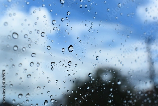 Fototapeta water drop on mirror with blue sky and white cloud background