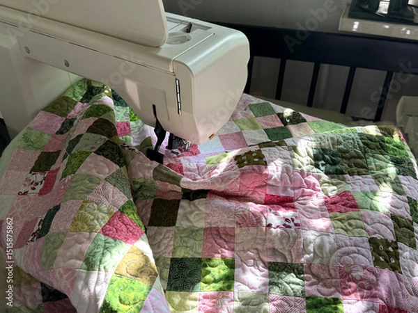 Fototapeta Patchwork Quilt in Sewing Machine. Free-Motion Quilting Concept. Handmade Mobile Photo, Selective Focus, Sunlight, Not AI