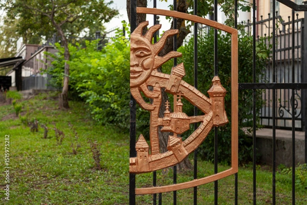 Fototapeta Gates of the Orthodox Church decorated with a forged pattern in the form of an ancient fortress