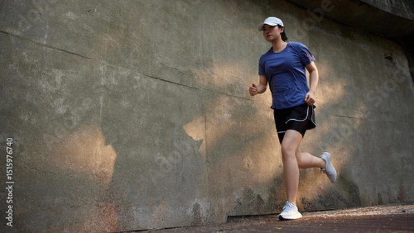 Fototapeta Outdoor Running Routine on a Sunny Day. Running
Motivation. Start Your Fitness Journey.