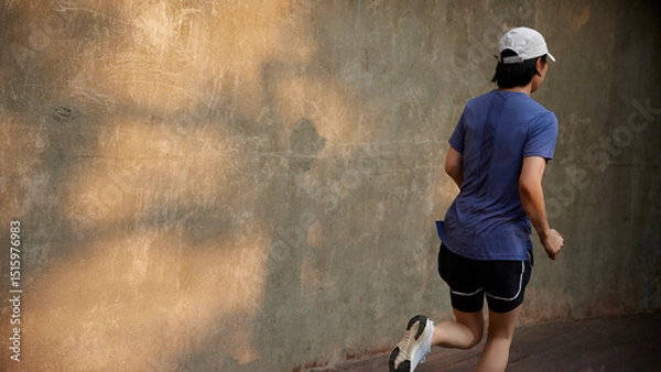 Fototapeta Outdoor Running Routine on a Sunny Day. Running
Motivation. Start Your Fitness Journey.