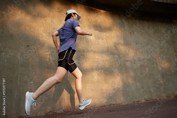 Fototapeta Outdoor Running Routine on a Sunny Day. Running
Motivation. Start Your Fitness Journey.