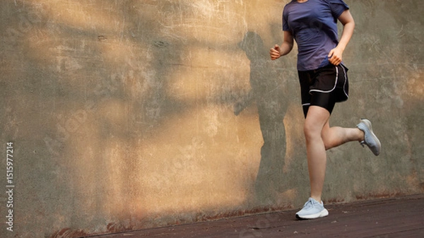 Fototapeta Outdoor Running Routine on a Sunny Day. Running
Motivation. Start Your Fitness Journey.