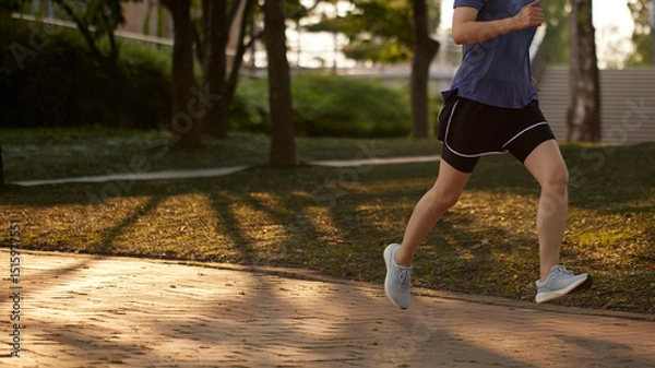 Fototapeta Outdoor Running Routine on a Sunny Day. Running
Motivation. Start Your Fitness Journey.