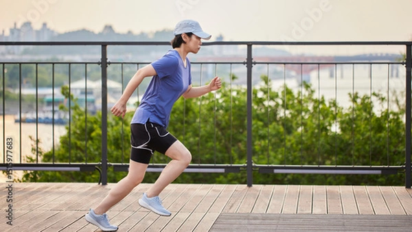 Fototapeta Outdoor Running Routine on a Sunny Day. Running
Motivation. Start Your Fitness Journey.