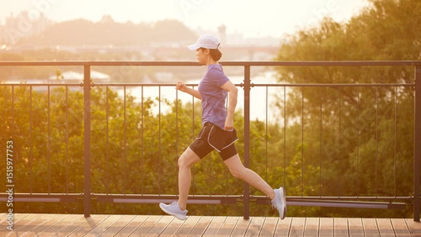 Fototapeta Outdoor Running Routine on a Sunny Day. Running
Motivation. Start Your Fitness Journey.