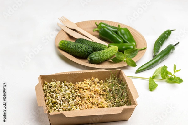 Fototapeta Sprouted grains of wheat, peas and mung bean in cardboard container.