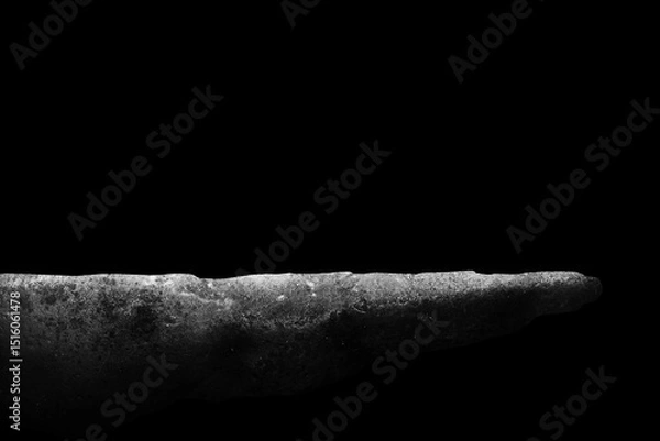 Obraz Stone podium on dark black background..