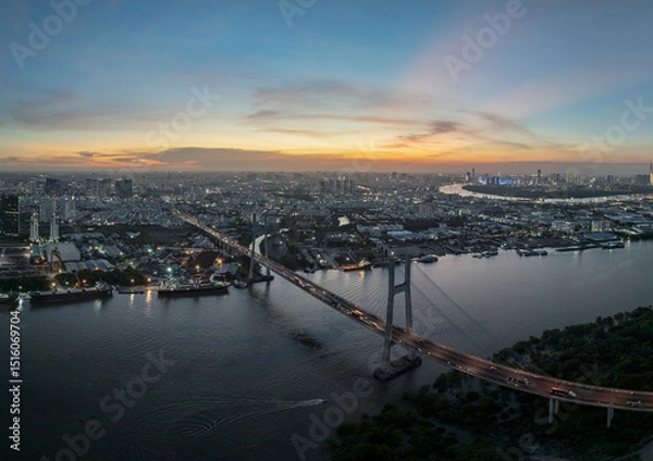 Fototapeta Stunning view of Phu My bridge over the Saigon River in Ho Chi Minh City at twilight