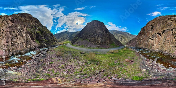 Obraz Full Spherical panorama of a mountain ravine with dirt road and river turn at springtime day in equirectangular projection