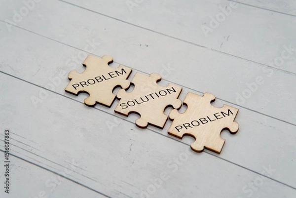 Obraz Three wooden jigsaw puzzle pieces with text PROBLEM and SOLUTION. Problem solving concept.