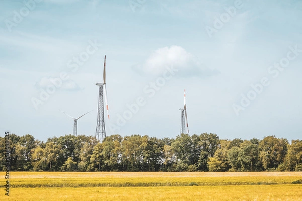 Fototapeta Wind Turbines with Wheat Field and Forest – Renewable Energy in Bramsche-Achmer, Germany