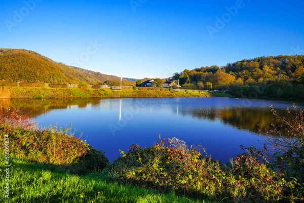 Obraz View of the Eiserbachsee lake in Rurberg near Simmerath. Landscape at the Eiserbach dam. Nature in the Eifel region.

