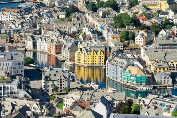 Fototapeta High angle view of downtown of Alesund on the west coast of Norway, with its colorful Art Nouveau buildings along the brosundet Canal in a sunny day