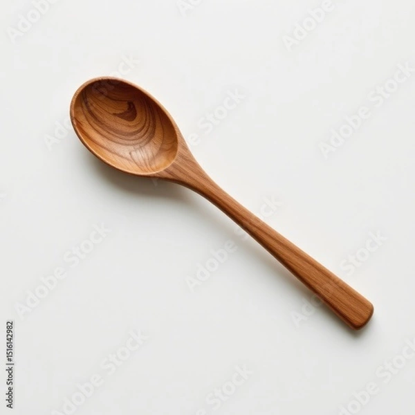 Fototapeta single wooden spoon on a white background, in a refined style, with sharp details, minimal reflection, studio glow, high resolution