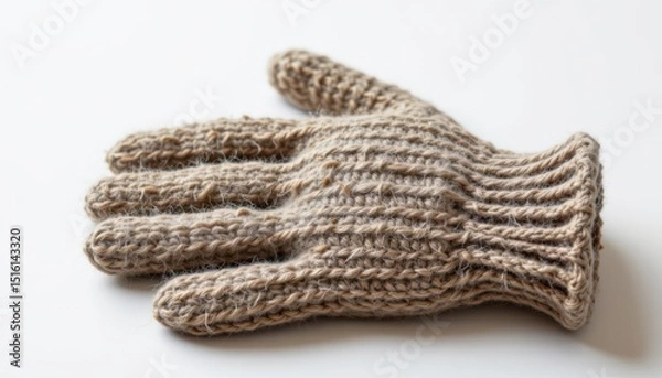Obraz single woolen glove on a white background, in a refined style, with sharp details, minimal reflection, studio glow, high resolution