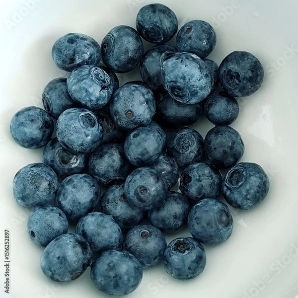 Fototapeta Blueberries in a white bowl. Close up. Toned.