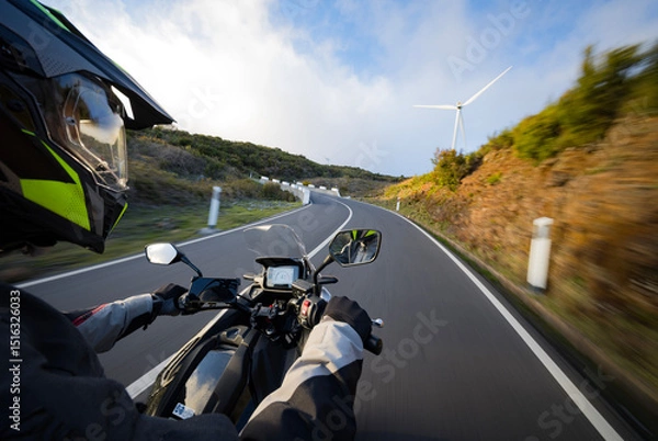 Fototapeta Driver riding motorcycle on empty asphalt road, handlebars view , spring mountains