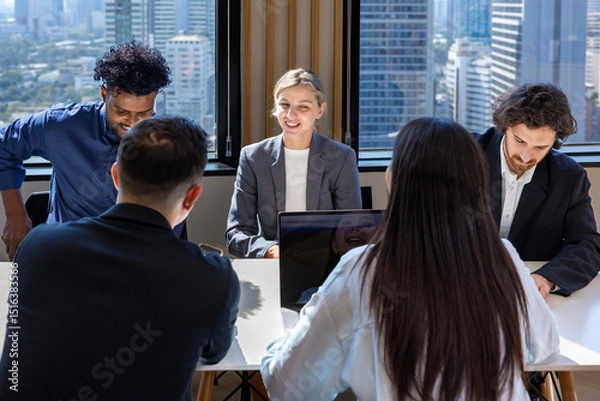 Fototapeta Team of diversity business people are discussing over new strategic strategy project on investment real estate while brainstorming around the office building for new project and planning