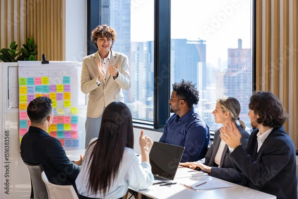 Fototapeta Team of happy diversity business people agreement on deal over new strategic strategy project on investment real estate with recognition and applause from other colleagues for partnership