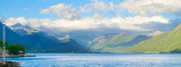 Fototapeta Norway. Nature in fjords. High mountains and reflections. Panoramic view. Clouds over the rocks. Vacation and travel in summer Norway. Background, wallpaper, postcards.